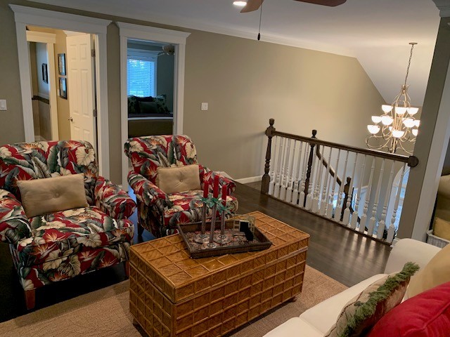 1829 Rizzi Lane Bartlett, IL 60103 - Photo 37 of 37 a living room with furniture and a chandelier