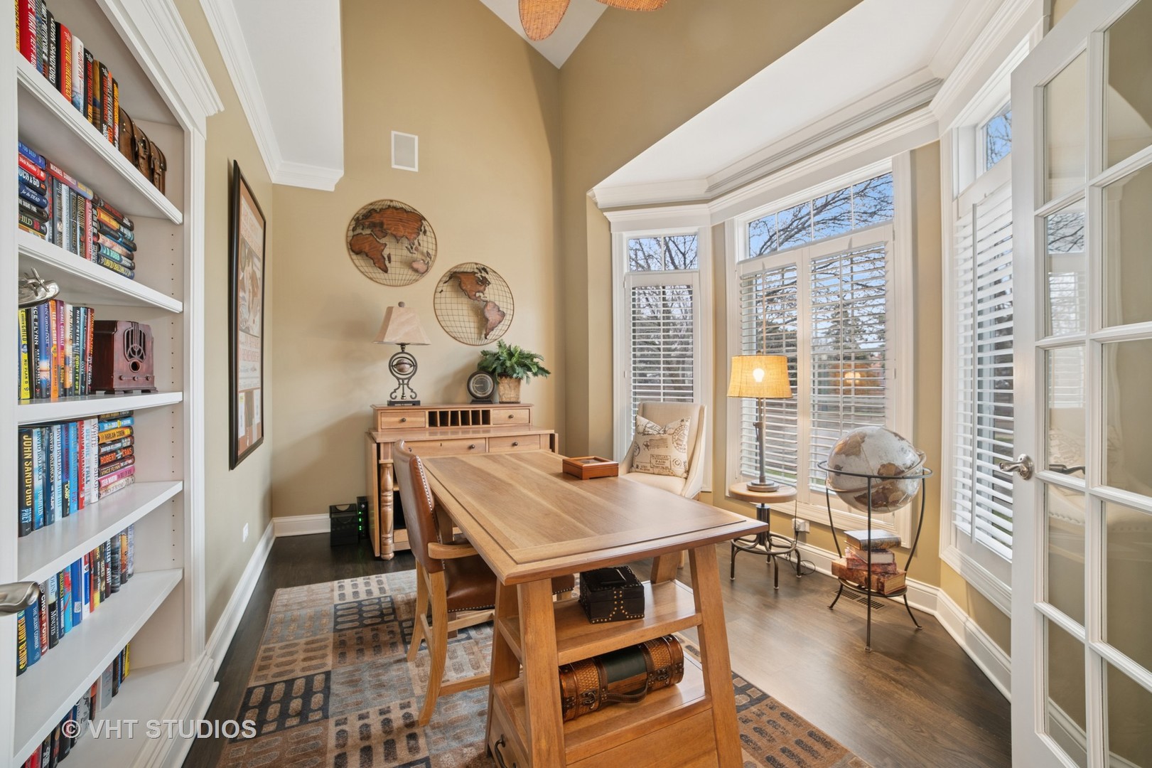 1829 Rizzi Lane Bartlett, IL 60103 - Photo 4 of 37 a view of a dining room with furniture and a book shelf