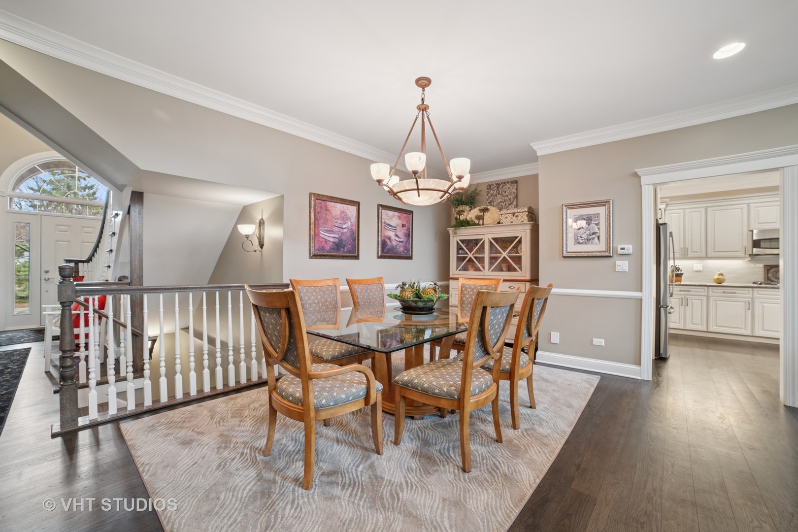 1829 Rizzi Lane Bartlett, IL 60103 - Photo 6 of 37 a view of a dining room with furniture and wooden floor