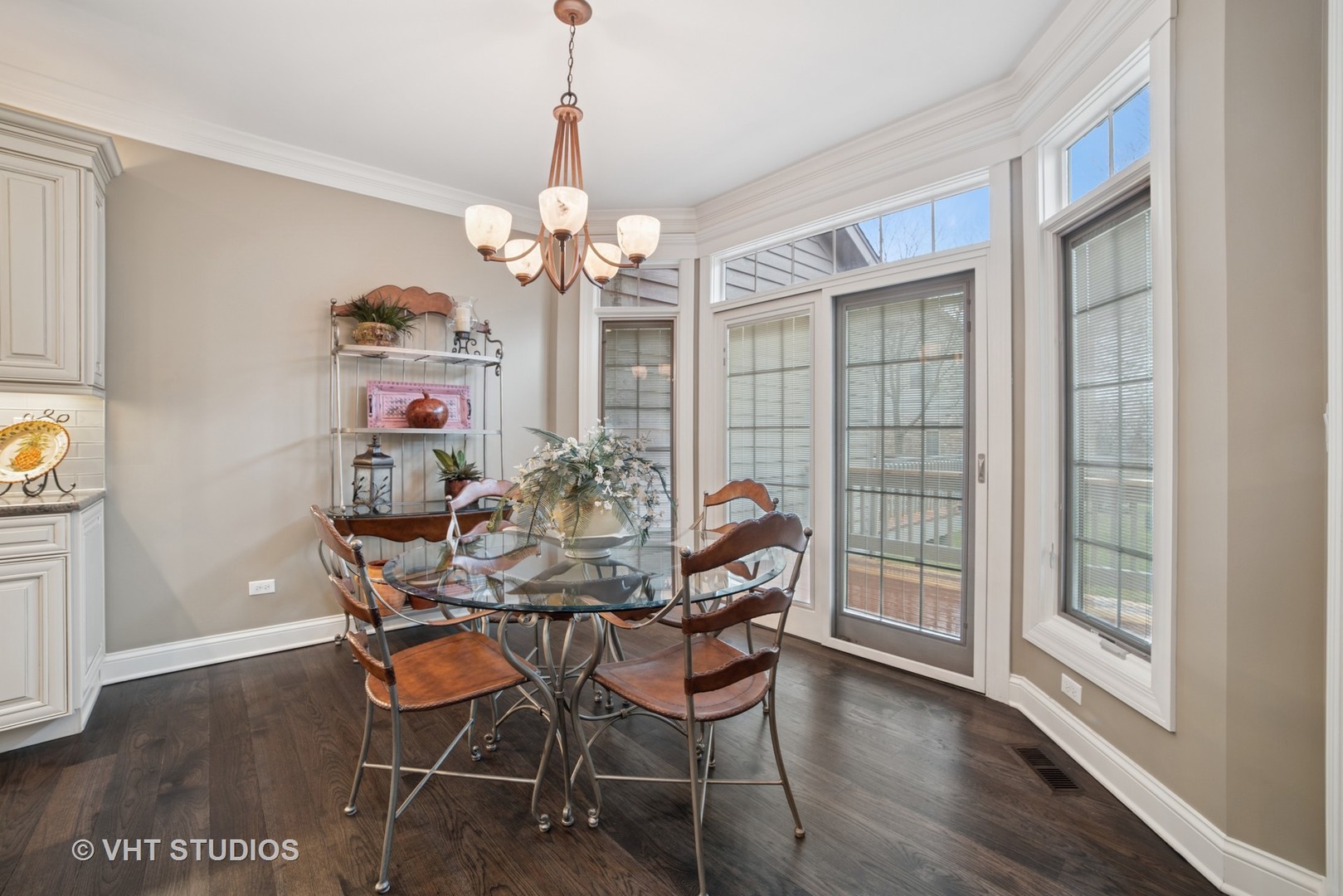 1829 Rizzi Lane Bartlett, IL 60103 - Photo 10 of 37 a view of a dining room with furniture wooden floor and chandelier