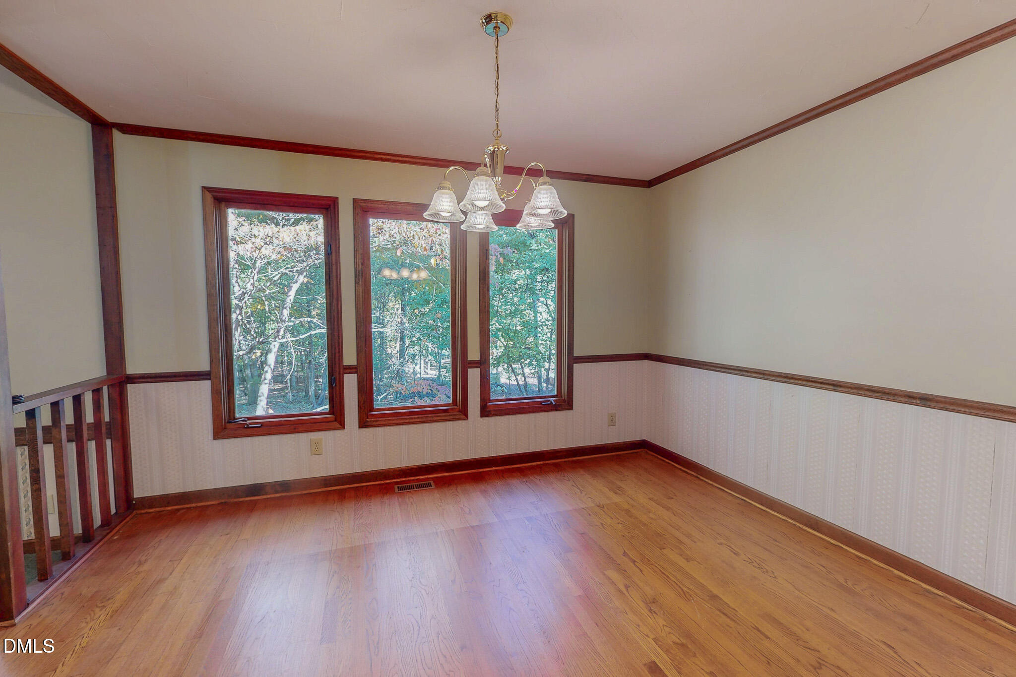 11 Denada Path Roxboro, NC 27574 - Photo 22 of 62 a view of an empty room with wooden floor and a window