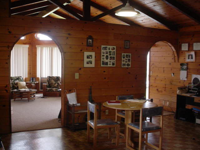 52 Hoaka Road Hilo, HI 96720 - Photo 11 of 11 a view of a dining room with furniture and wooden floor