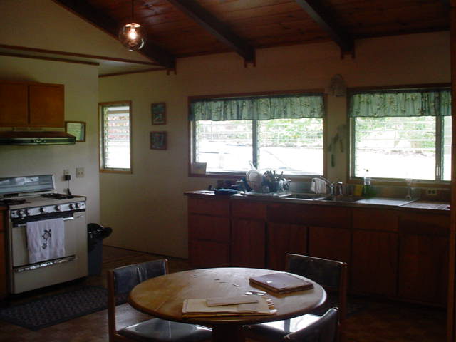 52 Hoaka Road Hilo, HI 96720 - Photo 9 of 11 a kitchen with a stove a sink and a window