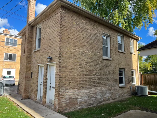 a brick building with a large windows
