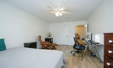 a view of a workspace with furniture and toys