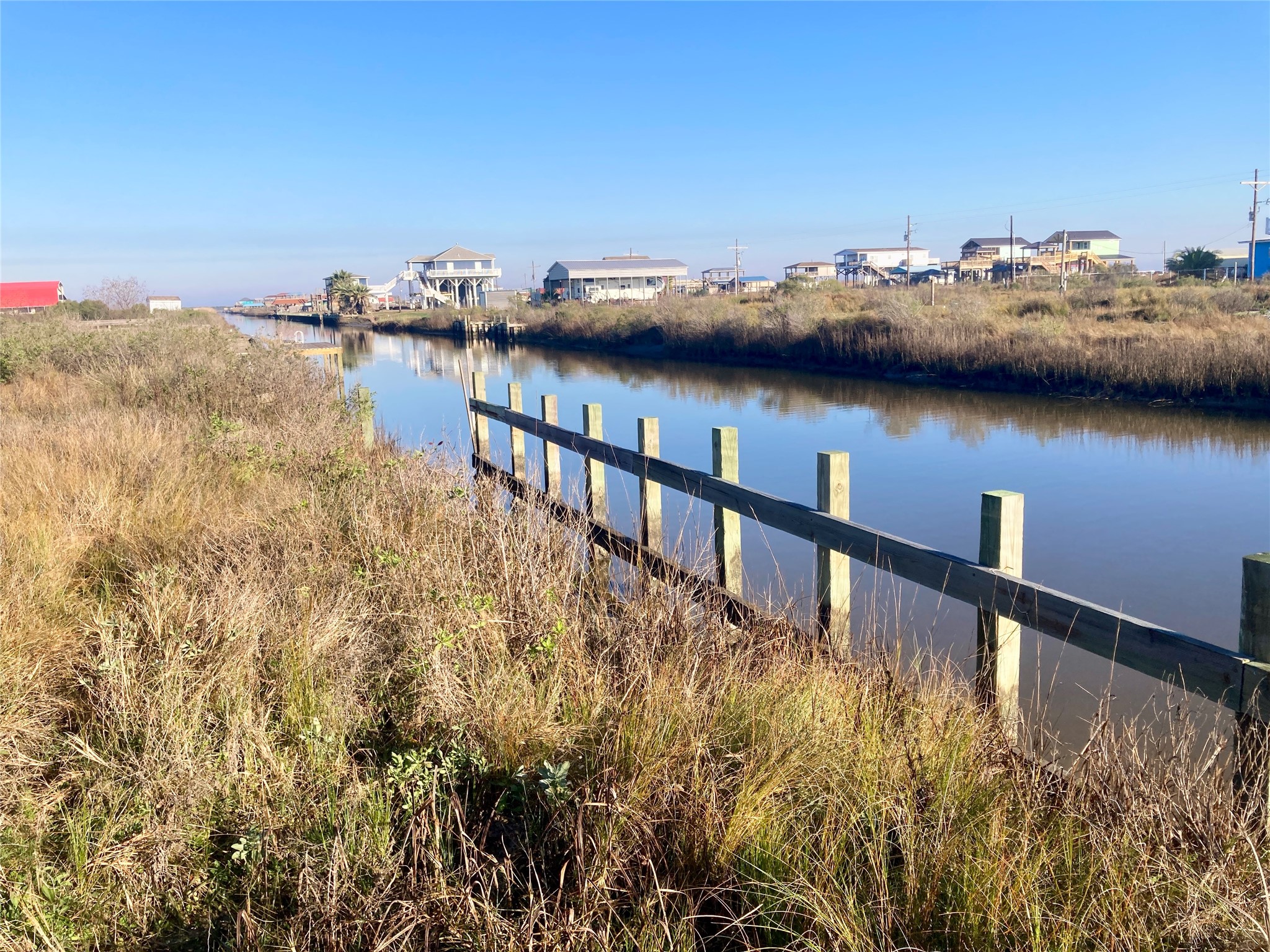 1136 Pennington Port Bolivar, TX 77650 - Photo 4 of 7 a view of a lake from a balcony