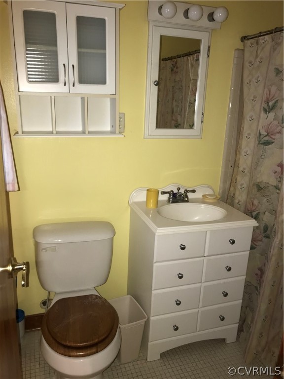 3800 Cedarpine Road Henrico, VA 23231 - Photo 11 of 15 a bathroom with a toilet a sink and mirror