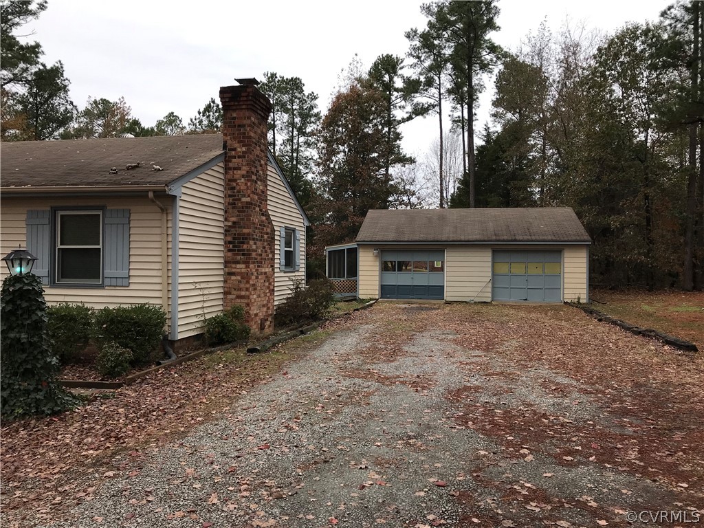 3800 Cedarpine Road Henrico, VA 23231 - Photo 2 of 15 a front view of a house with a yard and garage