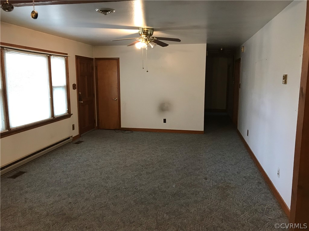 3800 Cedarpine Road Henrico, VA 23231 - Photo 4 of 15 an empty room with a ceiling fan and window