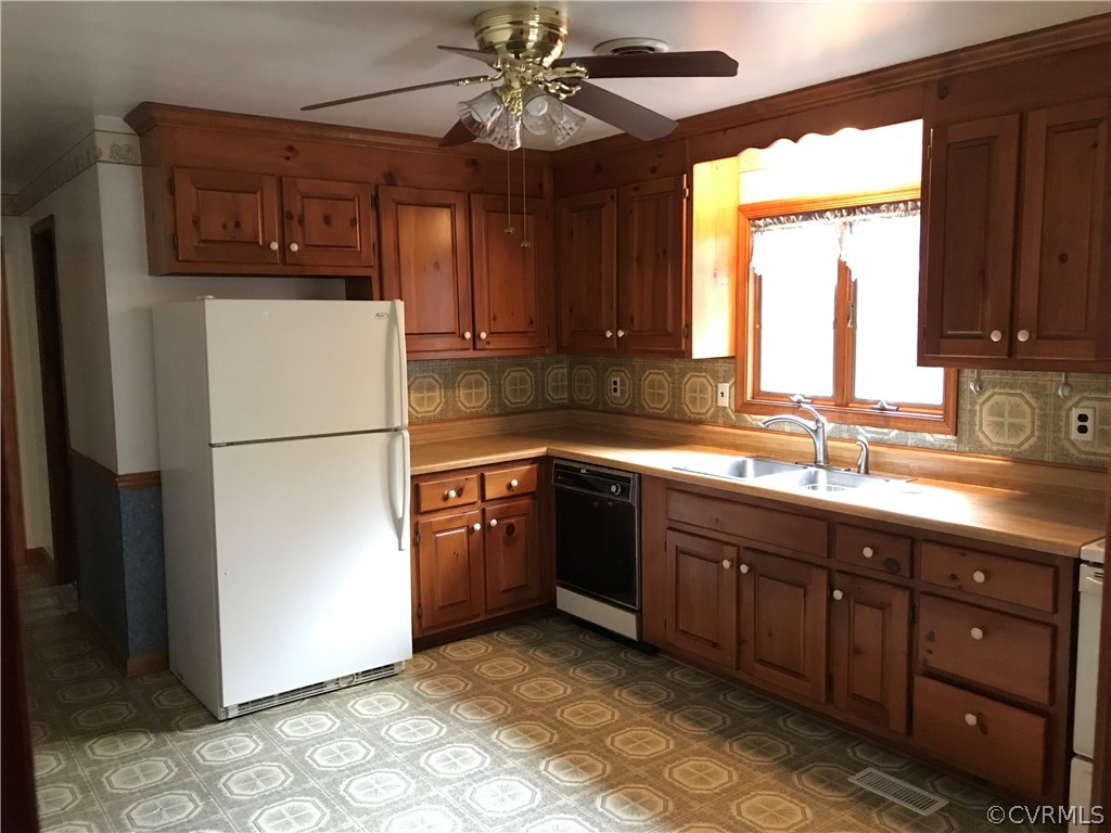 3800 Cedarpine Road Henrico, VA 23231 - Photo 5 of 15 a kitchen with stainless steel appliances granite countertop a refrigerator a sink dishwasher a stove top oven a refrigerator and cabinets