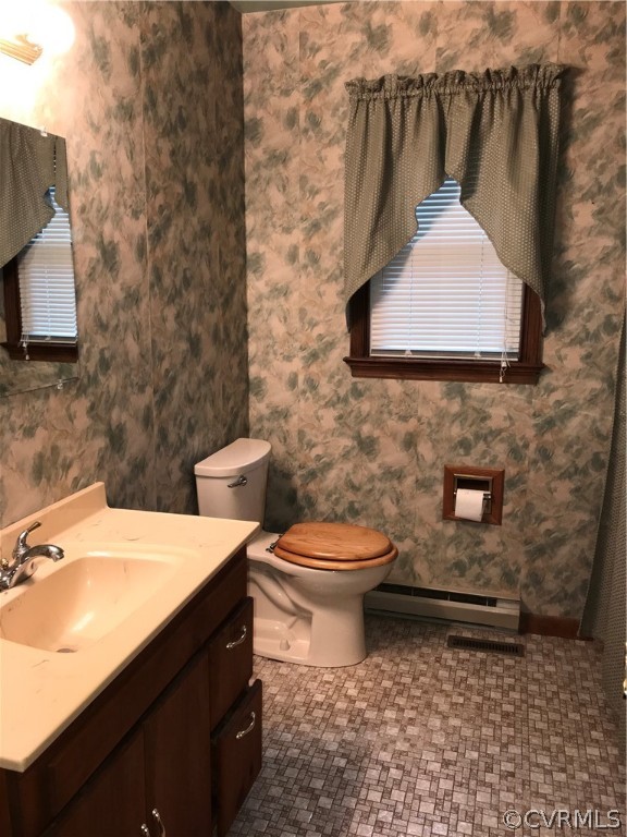 3800 Cedarpine Road Henrico, VA 23231 - Photo 7 of 15 a bathroom with a toilet and a sink