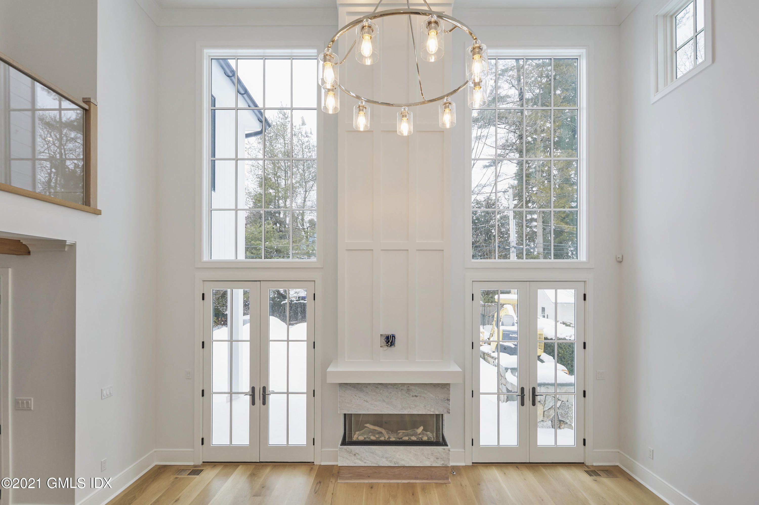 5 Chapel Lane Riverside, CT 06878 - Photo 17 of 46 an empty room with wooden floor fireplace and windows