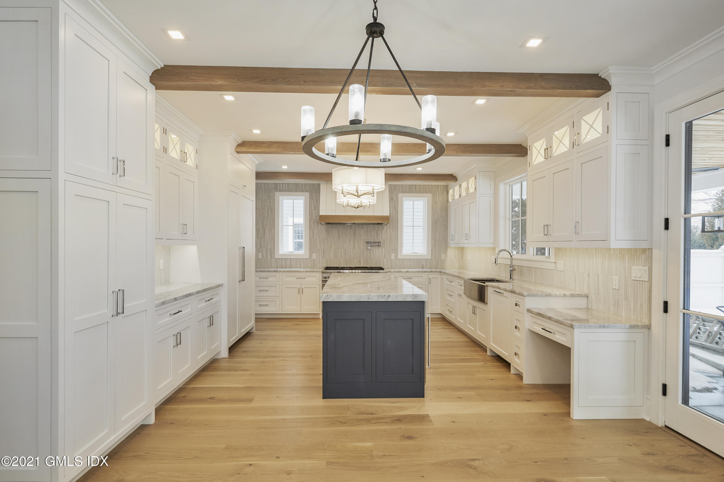 5 Chapel Lane Riverside, CT 06878 - Photo 20 of 46 a large kitchen with a lot of counter space and a wooden floor