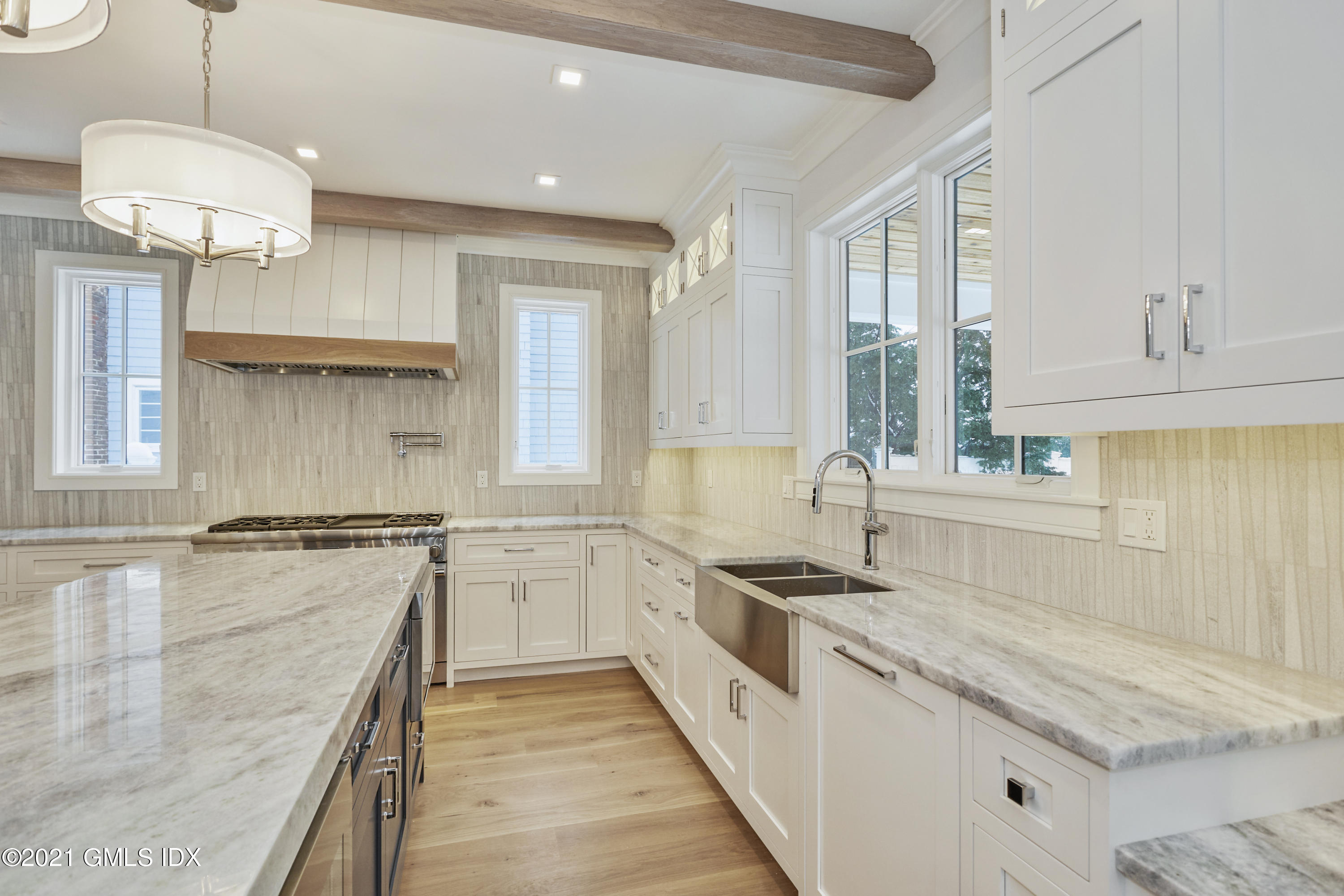 5 Chapel Lane Riverside, CT 06878 - Photo 24 of 46 a kitchen with a sink stove and cabinets