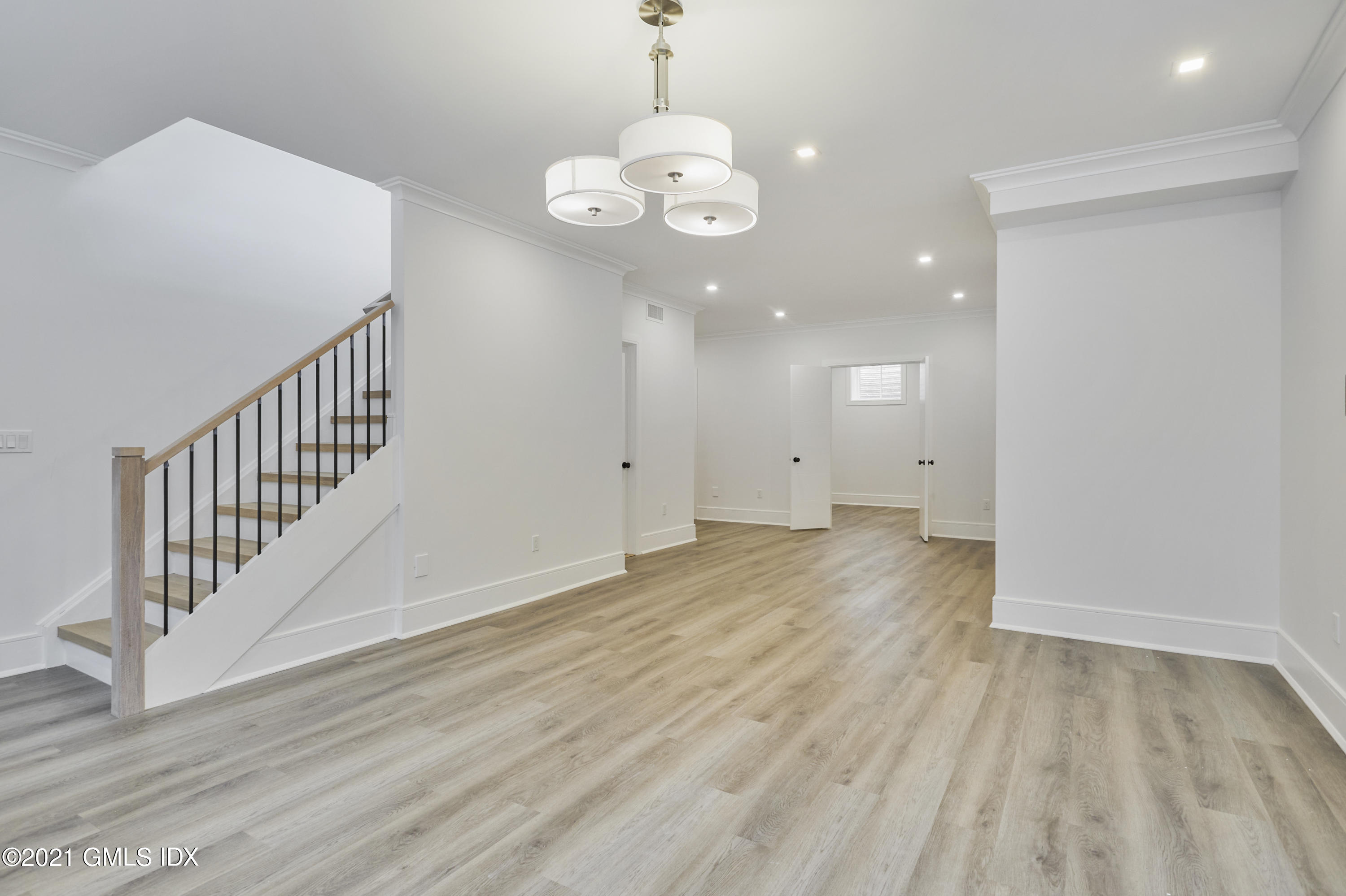 5 Chapel Lane Riverside, CT 06878 - Photo 44 of 46 an empty room with wooden floor and windows