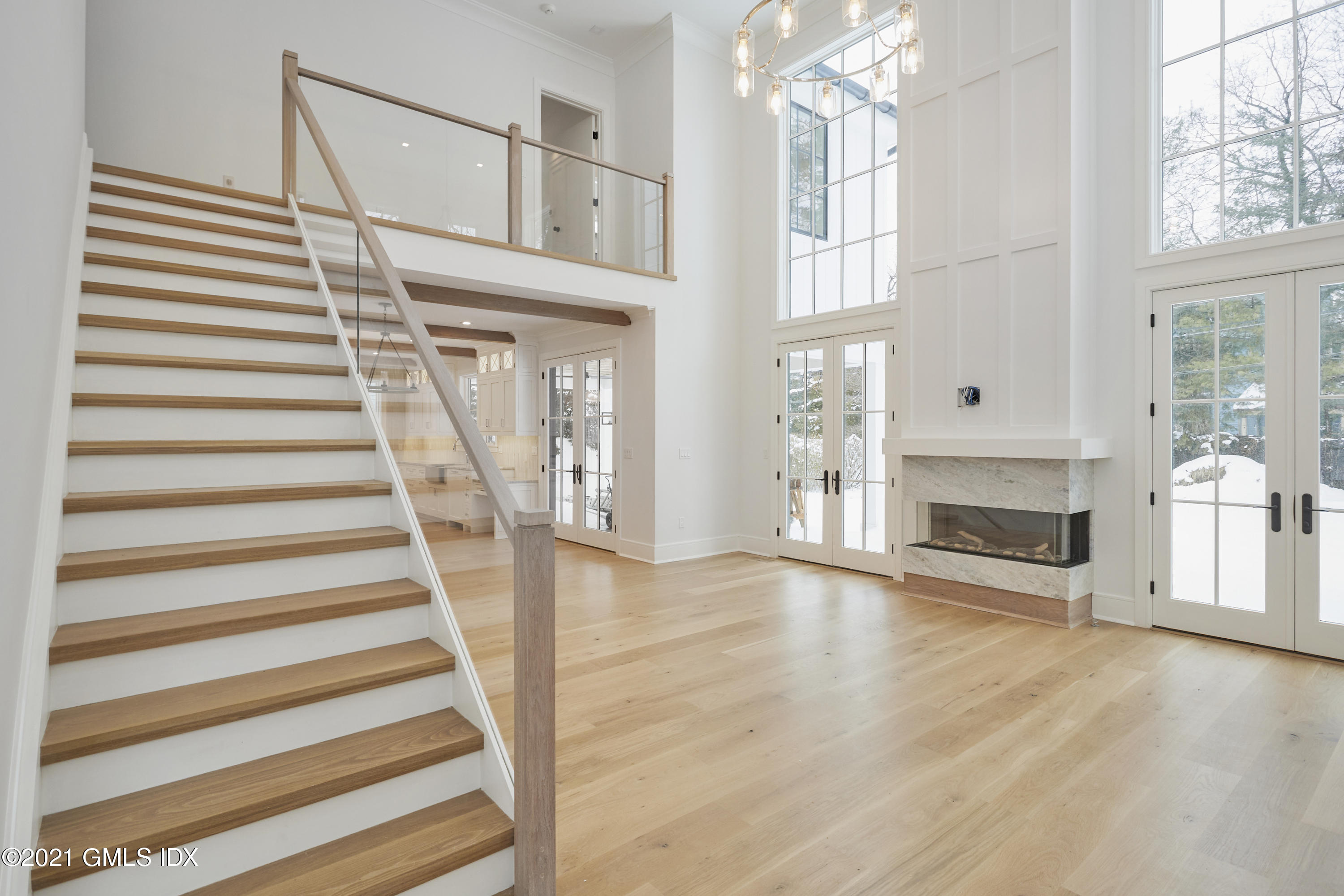 5 Chapel Lane Riverside, CT 06878 - Photo 6 of 46 a view of an entryway with wooden floor and a fireplace