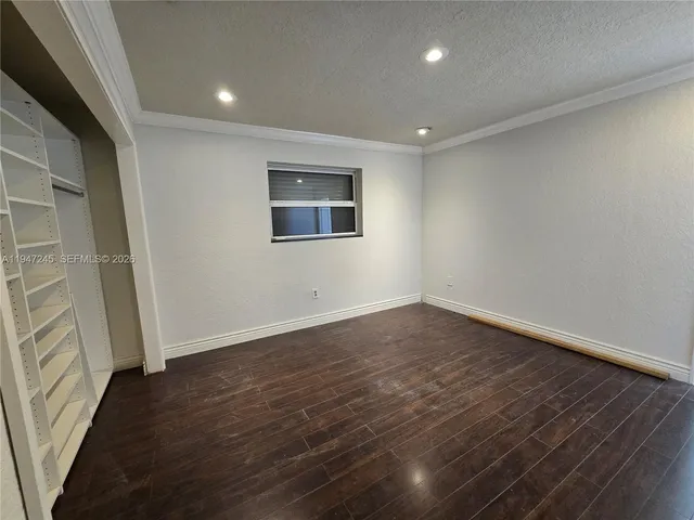 a spacious bathroom with a granite countertop sink a toilet and shower