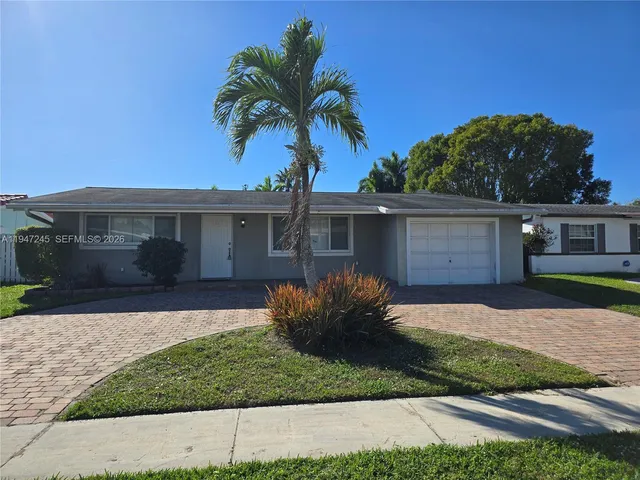front view of a house and a yard