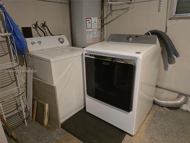 a bedroom with bed and glass door
