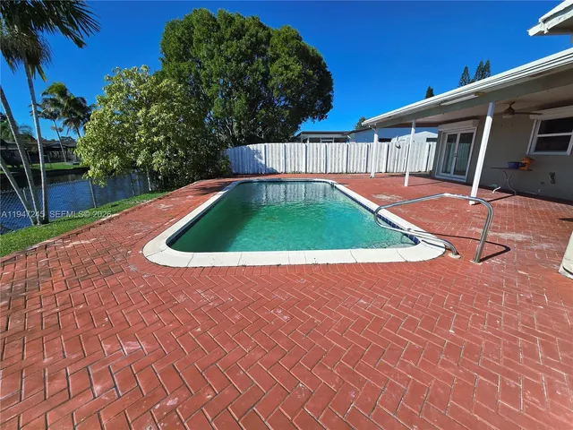 a view of a lake with a house in the background