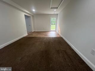 11064 Demarr Road White Plains, MD 20695 - Photo 52 of 98 an empty room with wooden floor and windows in it