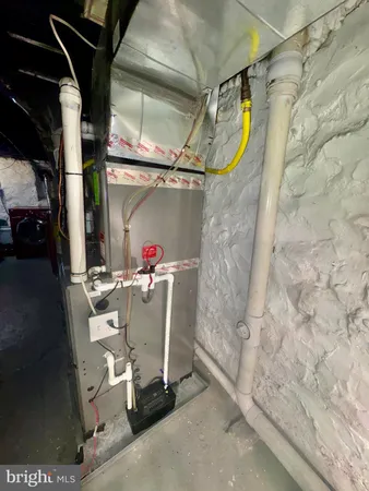a kitchen with granite countertop a sink and a white cabinets
