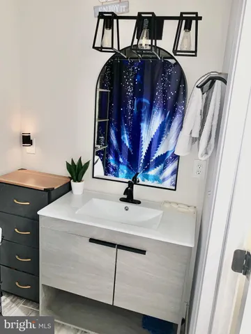 a view of hall way with furniture and chandelier