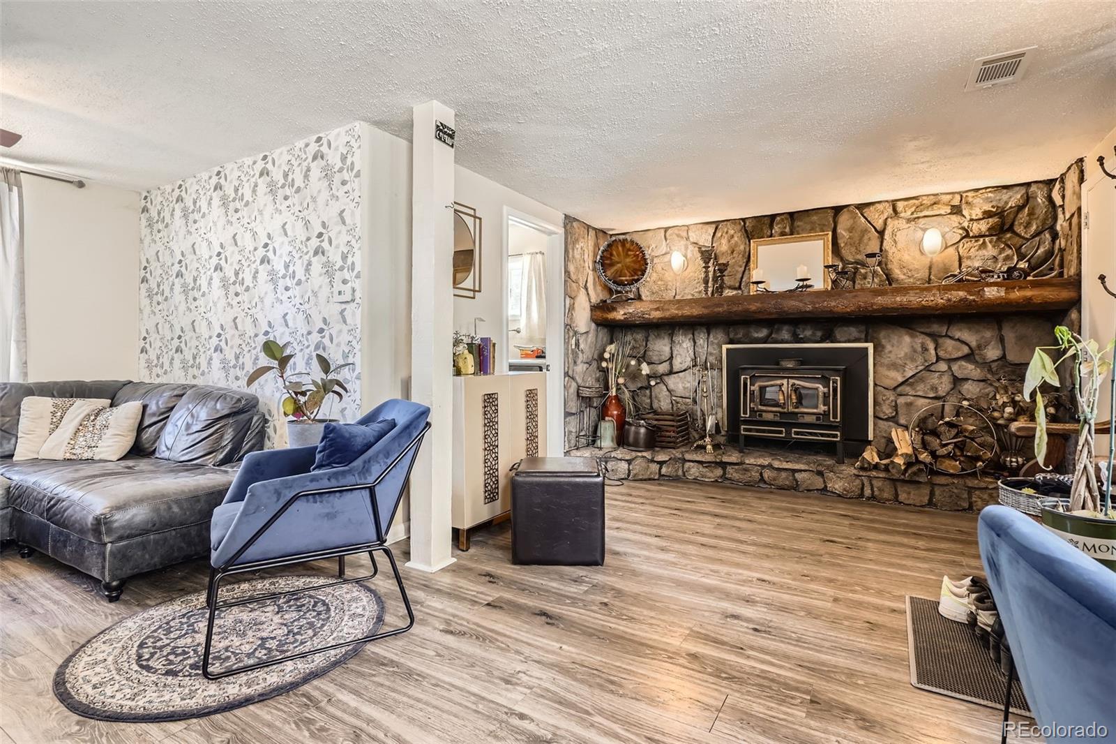 33 L Road Golden, CO 80403 - Photo 1 of 49 a living room with furniture a dining table and a fireplace