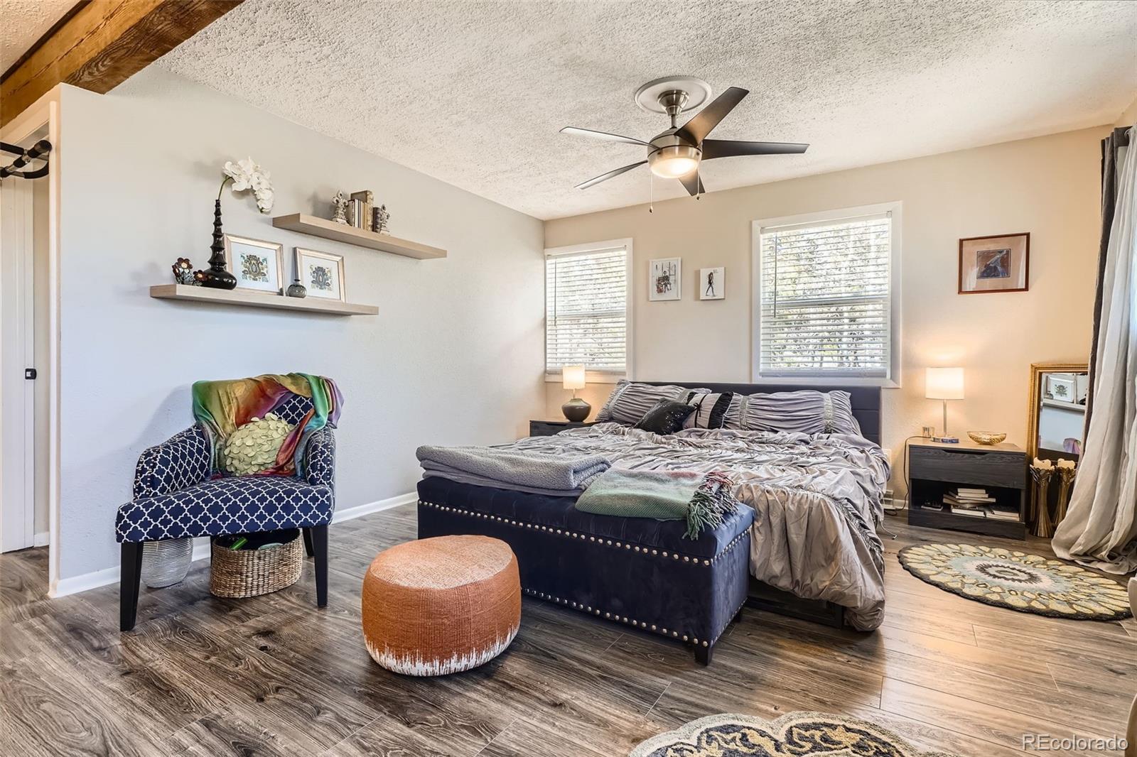33 L Road Golden, CO 80403 - Photo 15 of 49 a bedroom with a bed and wooden floor