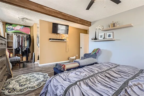 a bedroom with a bed and a walk in closet