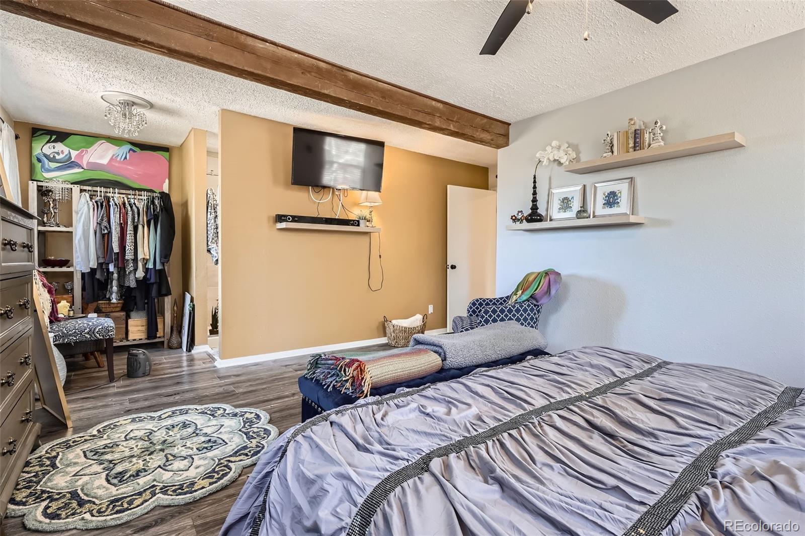 33 L Road Golden, CO 80403 - Photo 16 of 49 a bedroom with a bed and a walk in closet