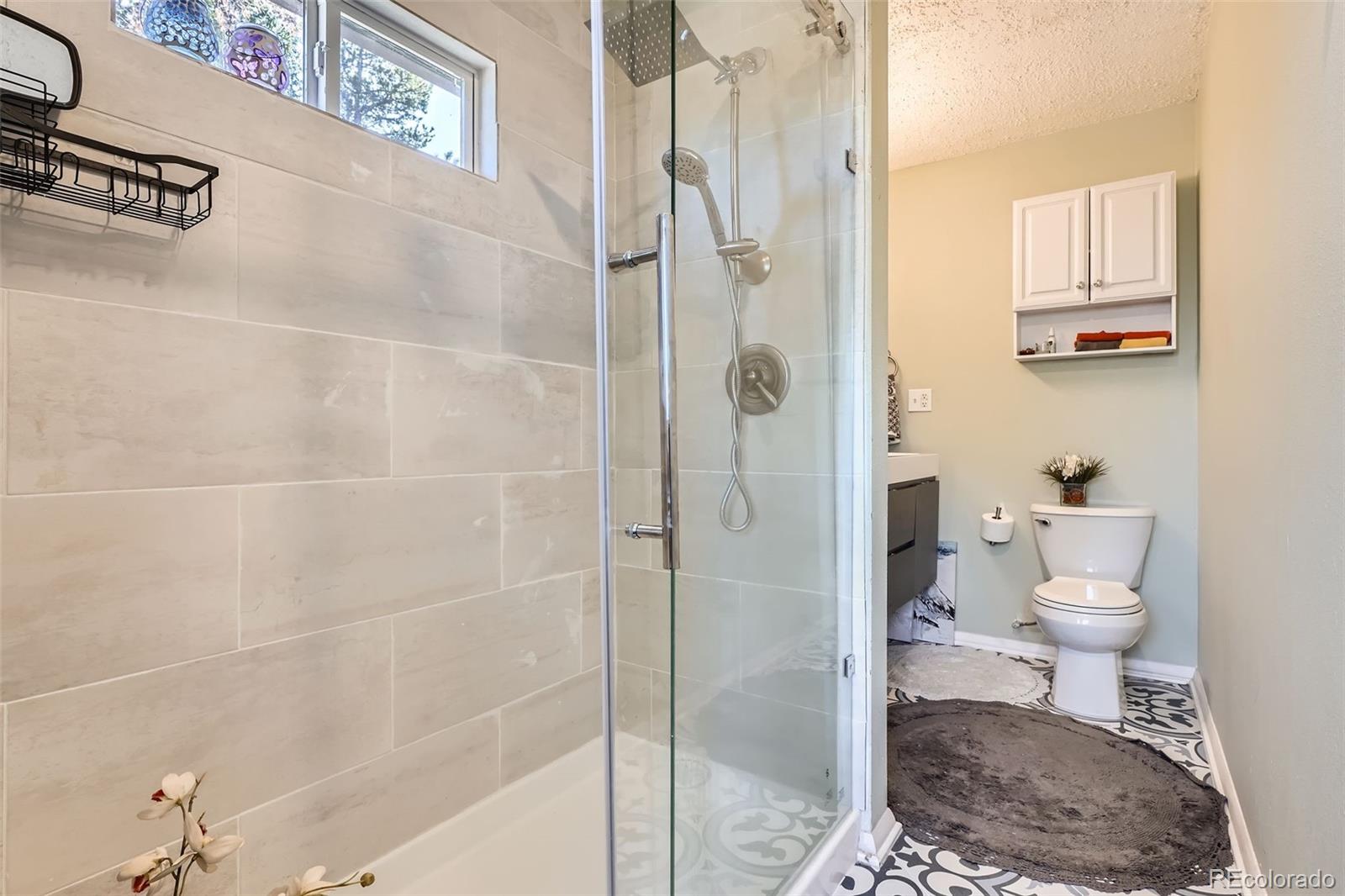 33 L Road Golden, CO 80403 - Photo 18 of 49 a bathroom with a toilet and a shower