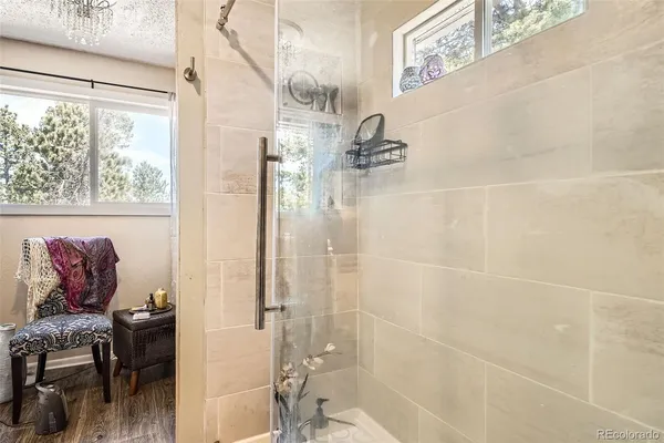 a bathroom with a bathtub and shower