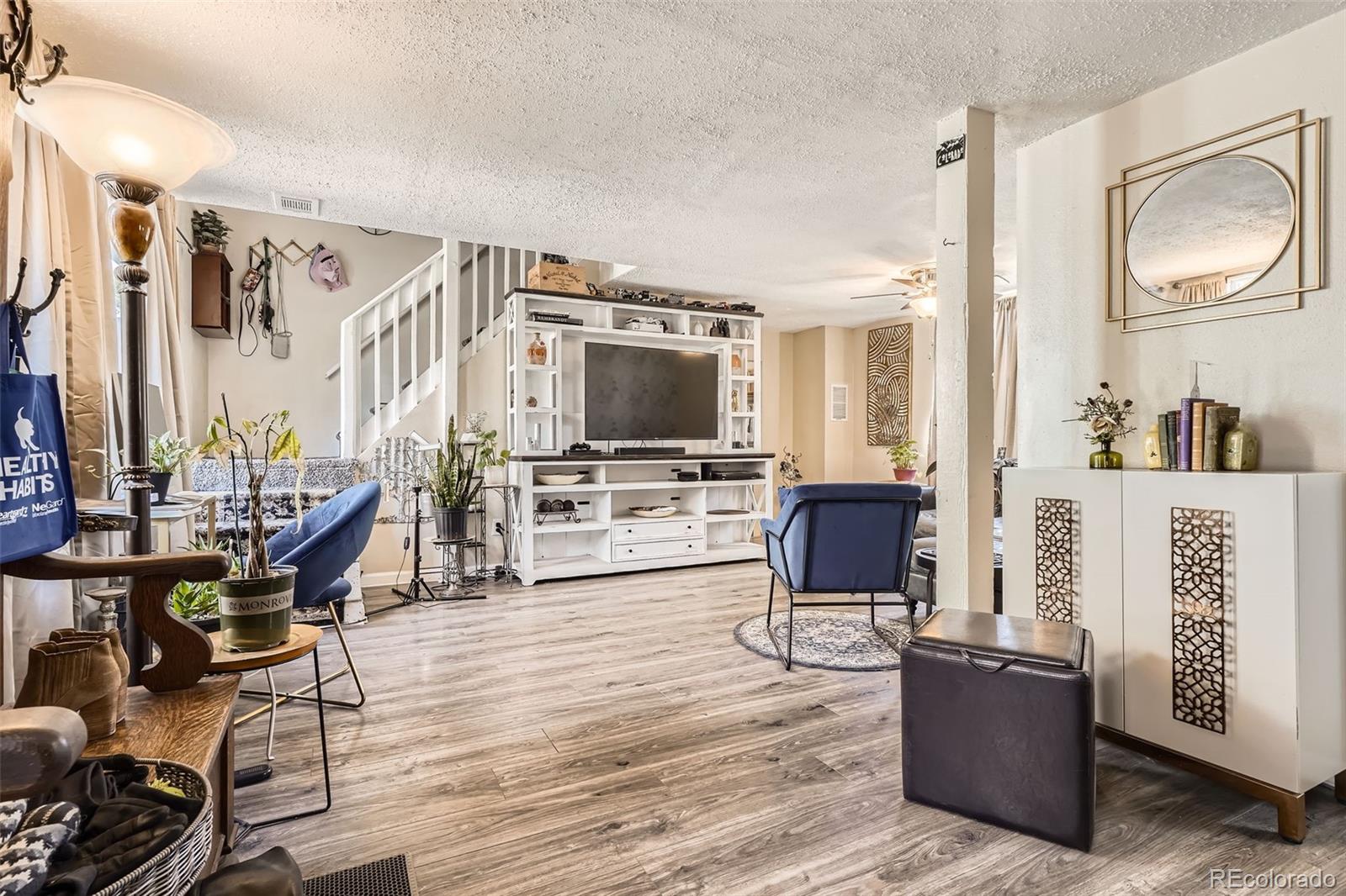 33 L Road Golden, CO 80403 - Photo 2 of 49 a living room with furniture and a flat screen tv