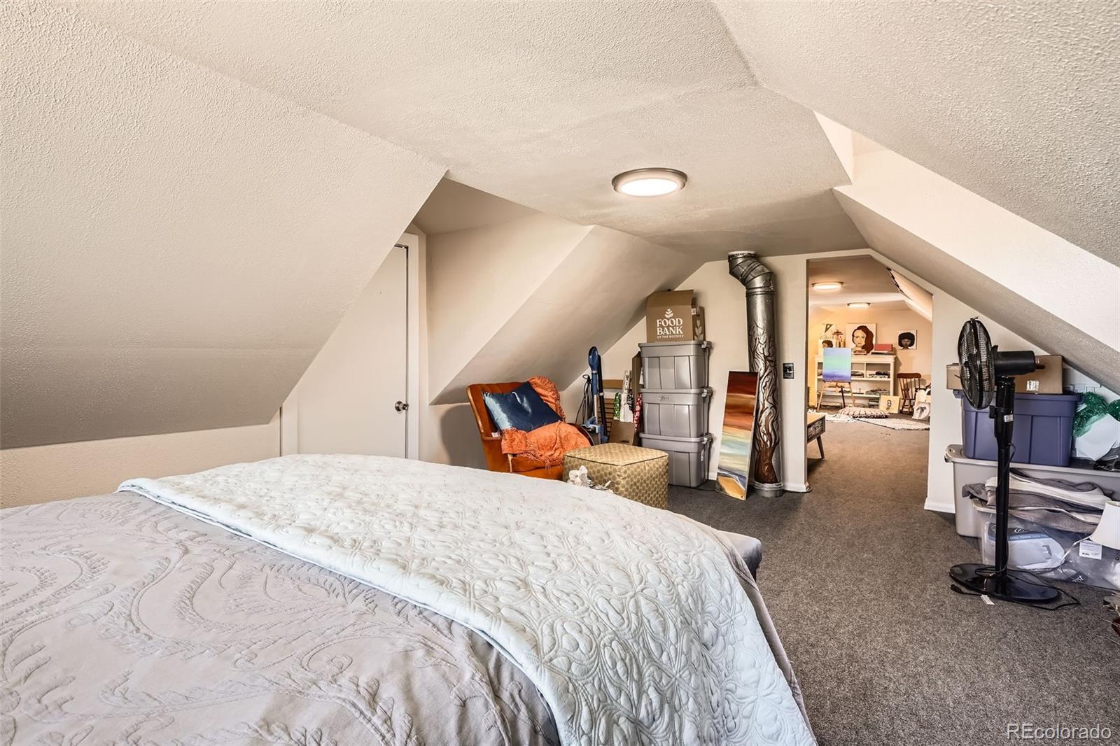 33 L Road Golden, CO 80403 - Photo 26 of 49 a bed room with a bed and a walk in closet