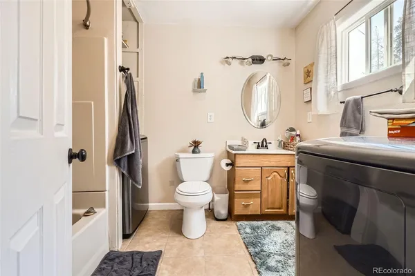 a bathroom with a tub and a shower