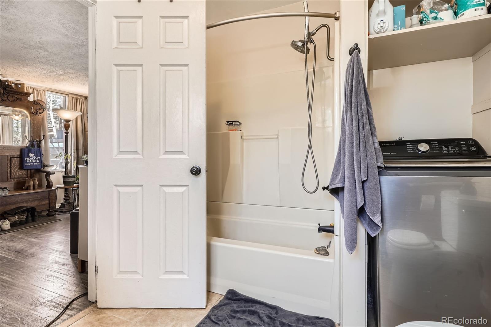 33 L Road Golden, CO 80403 - Photo 32 of 49 a bathroom with a tub and a shower