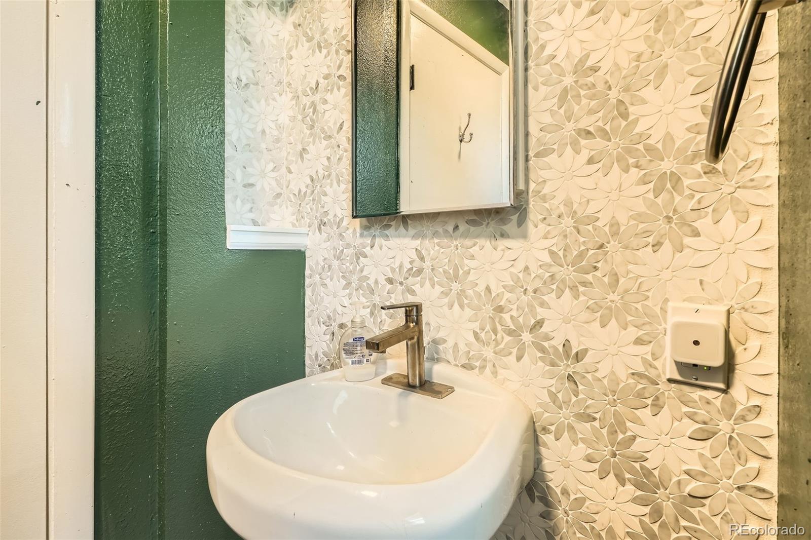 33 L Road Golden, CO 80403 - Photo 33 of 49 a bathroom with a sink and a mirror