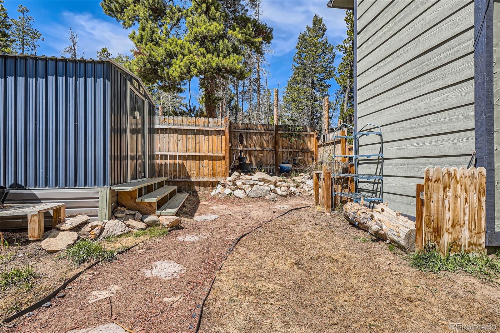 33 L Road Golden, CO 80403 - Photo 35 of 49 a view of house with backyard and sitting area
