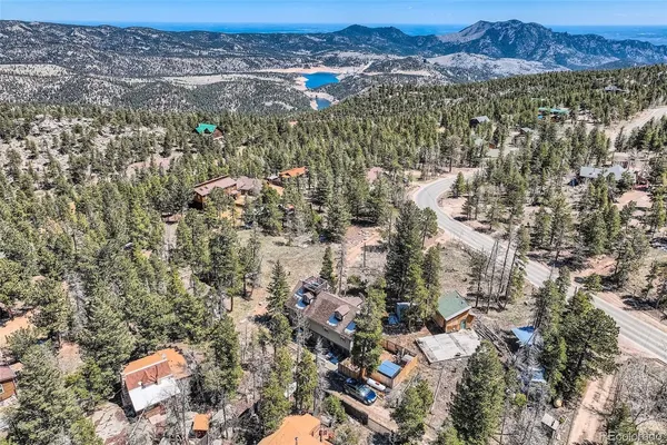 an aerial view of a houses with a yard