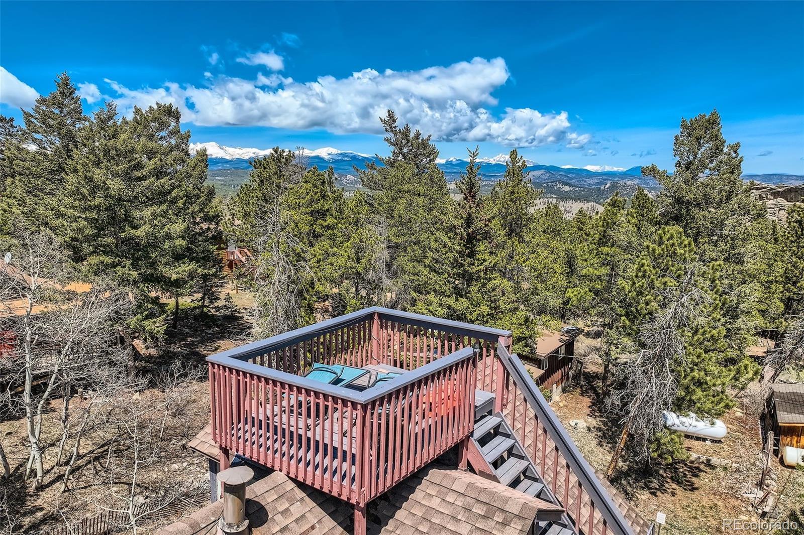33 L Road Golden, CO 80403 - Photo 7 of 49 a view of a roof deck with wooden floor and city view