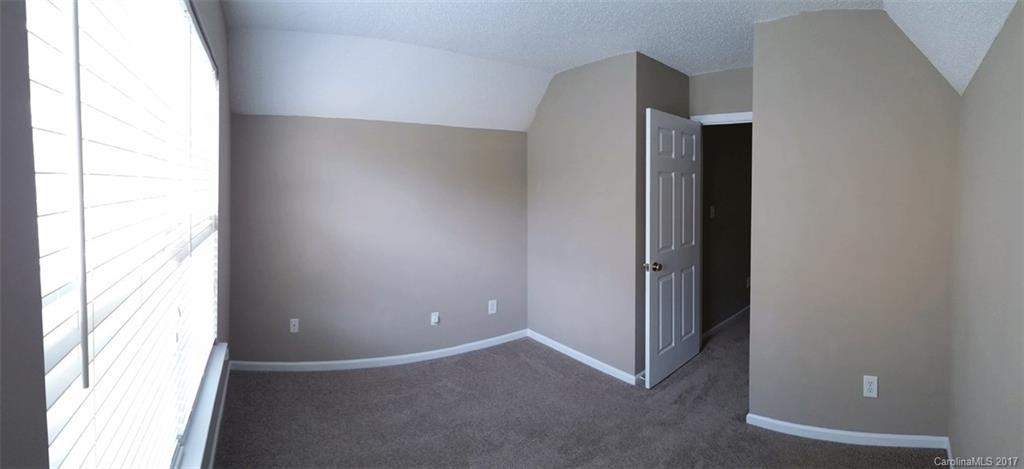11203 Gold Pan Road Charlotte, NC 28215 - Photo 10 of 15 an empty room with windows