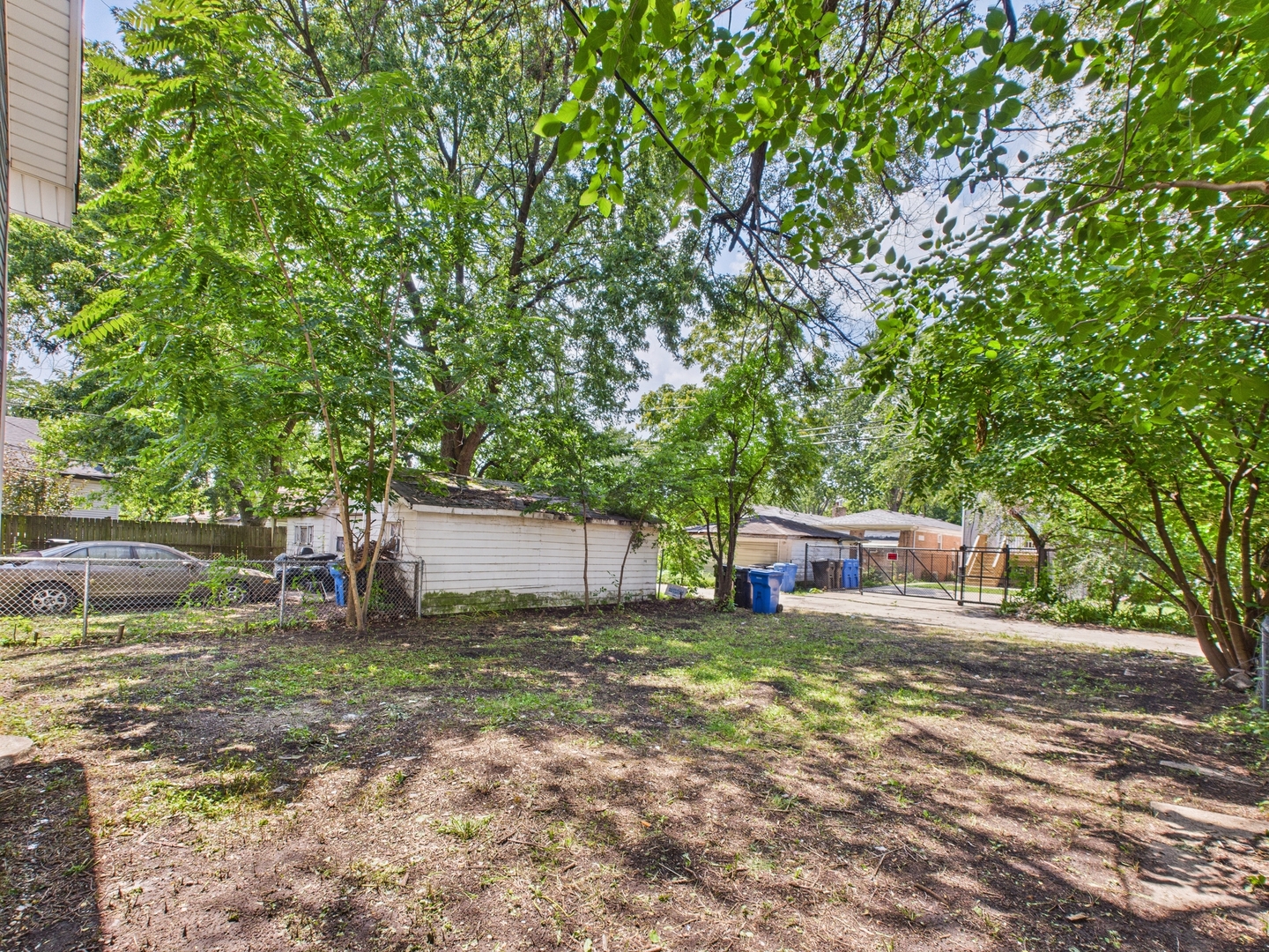 11922 South Perry Avenue Chicago, IL 60628 - Photo 22 of 23 a view of a backyard with a sitting area
