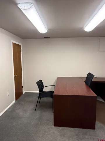 a room with a bed and a chair