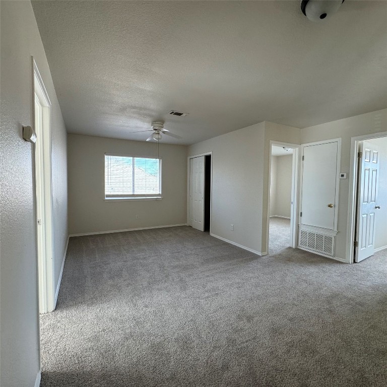 4735 Castleman Drive Austin, TX 78724 - Photo 6 of 16 a view of an empty room with windows