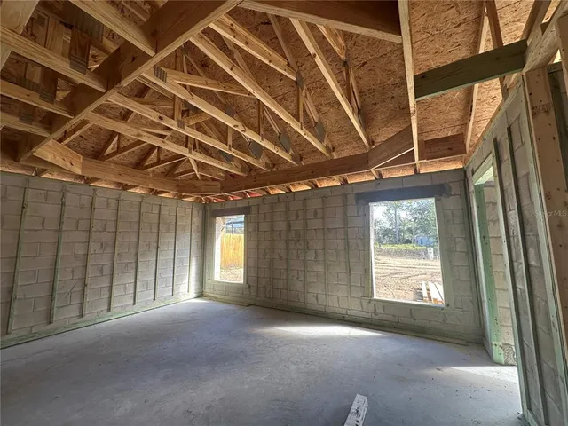 a view of empty room with windows