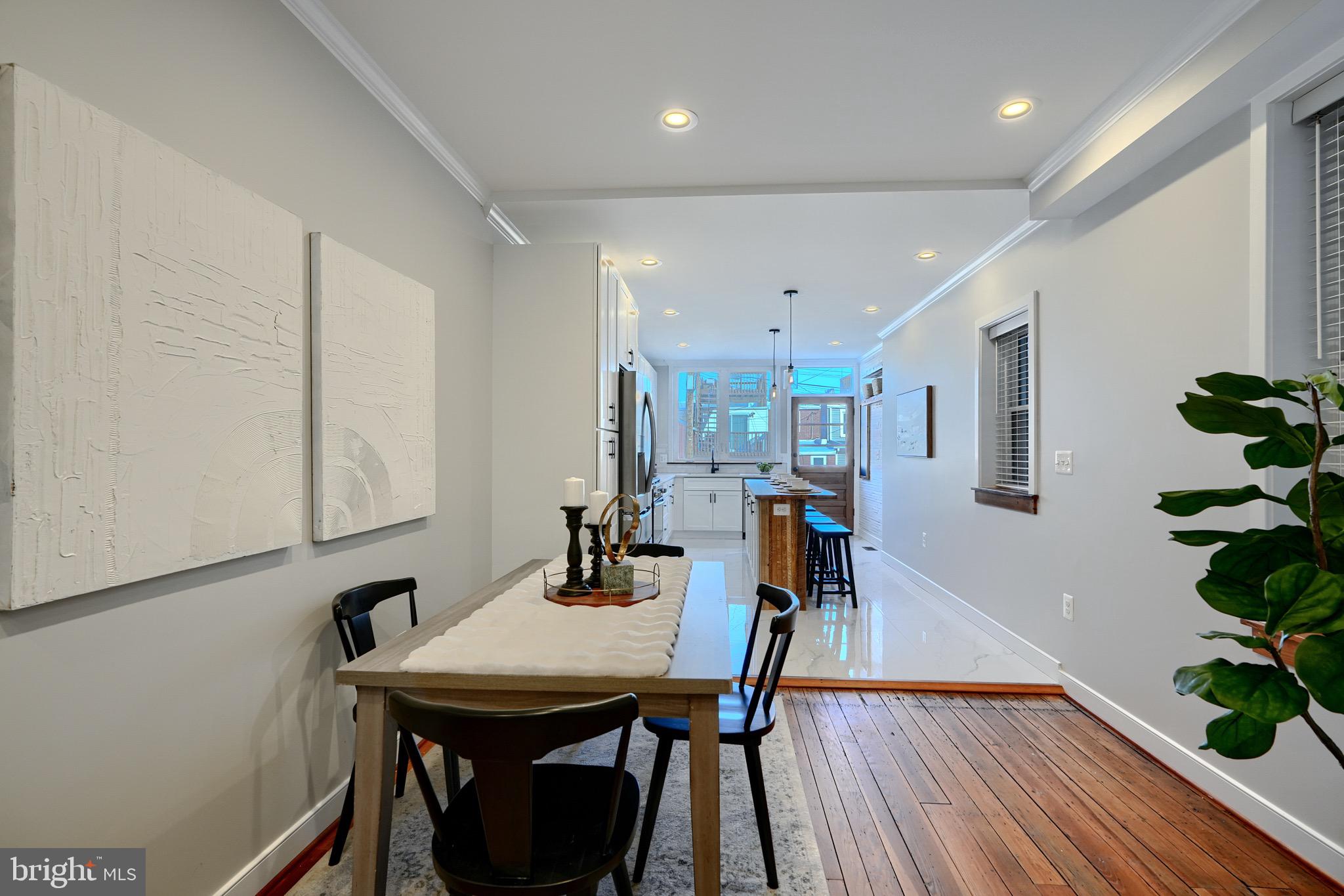 1435 Riverside Avenue Baltimore, MD 21230 - Photo 19 of 78 a view of a dining room with furniture and wooden floor