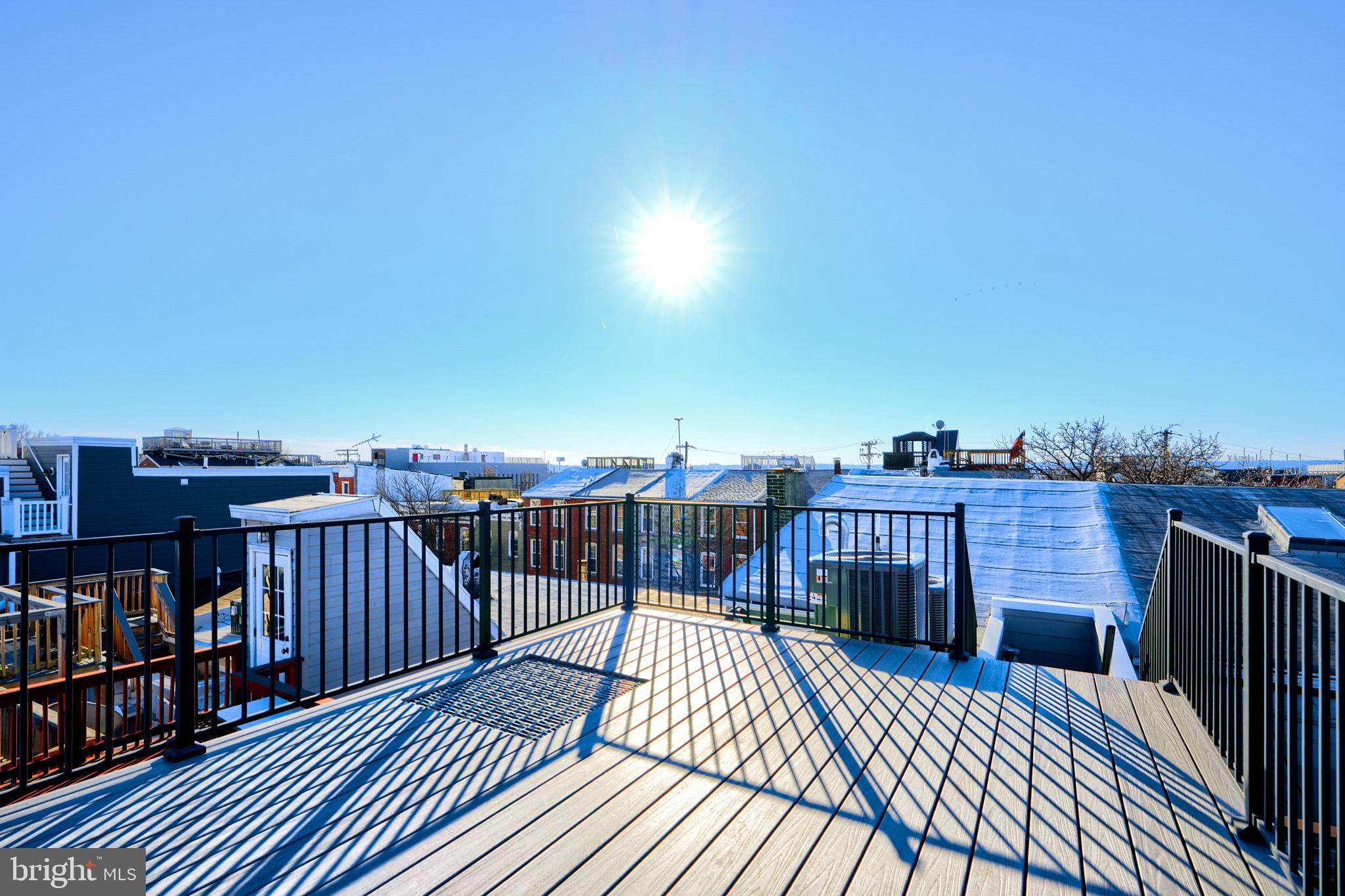 1435 Riverside Avenue Baltimore, MD 21230 - Photo 2 of 78 a view of a balcony with wooden floor
