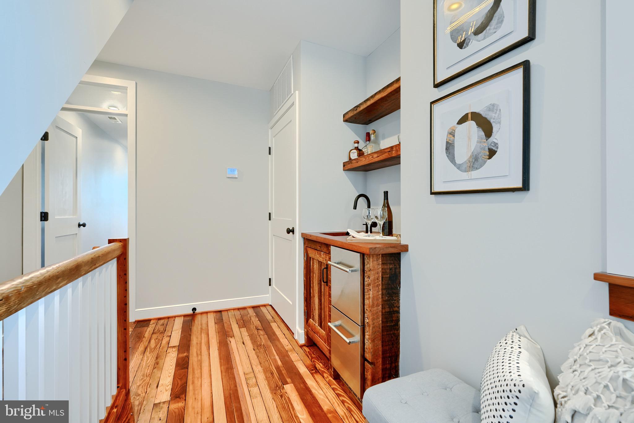 1435 Riverside Avenue Baltimore, MD 21230 - Photo 24 of 78 a view of hallway with furniture and wooden floor