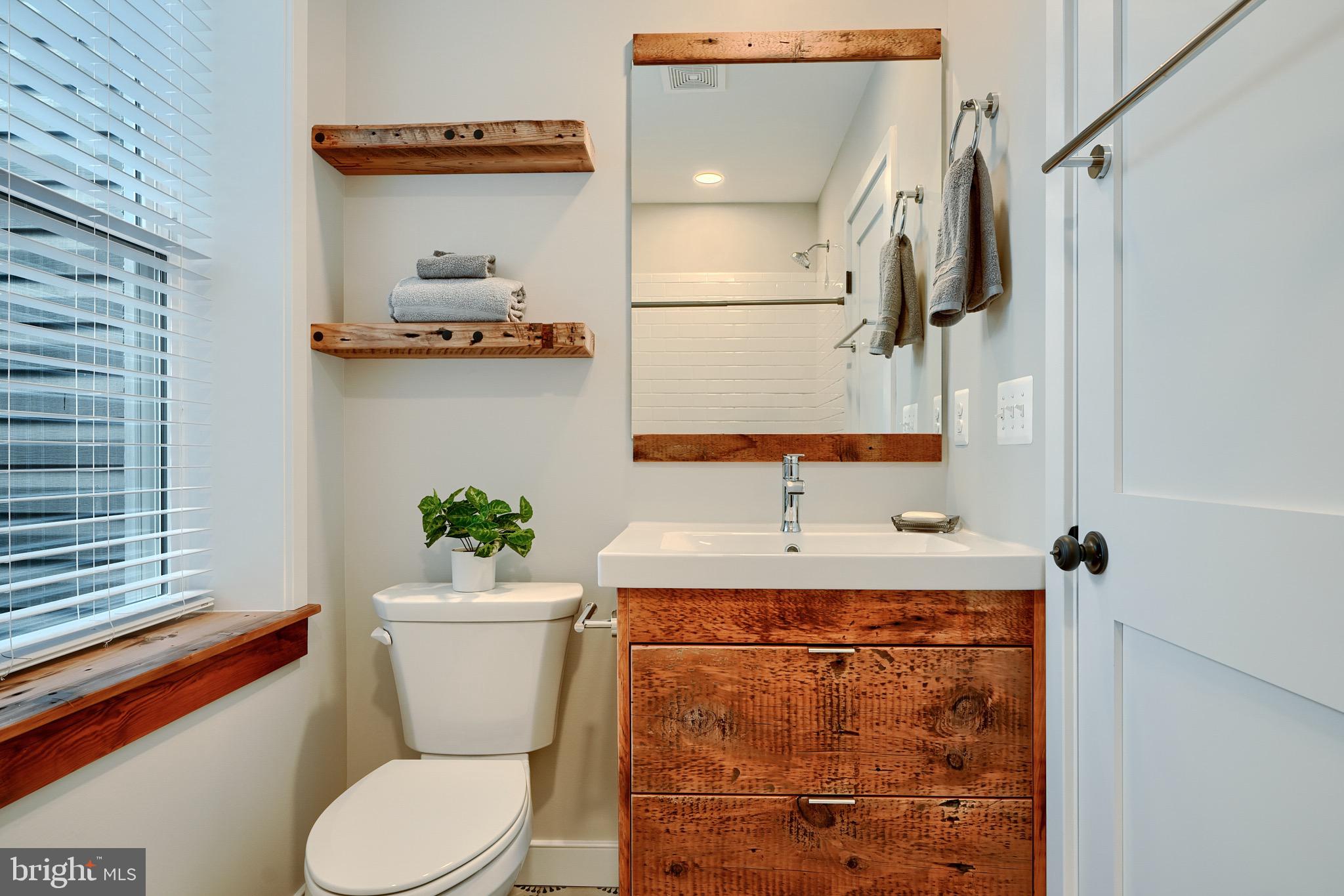 1435 Riverside Avenue Baltimore, MD 21230 - Photo 30 of 78 a bathroom with a sink a toilet and shower